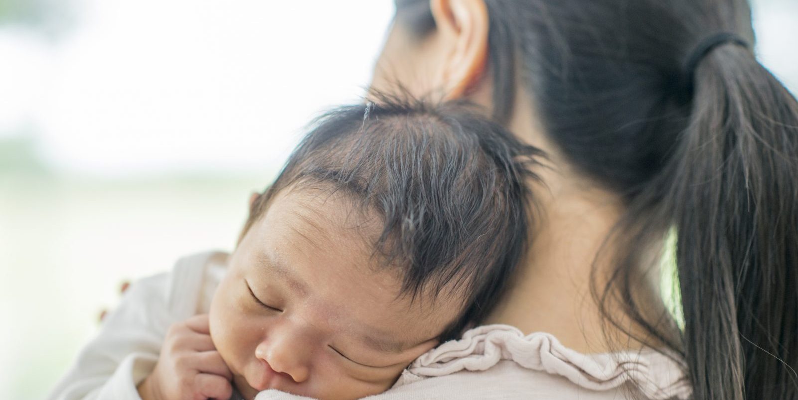 asian baby sleeping shoulder mother back ponytail postpartum hair loss tips how to fix viviscal hair blog