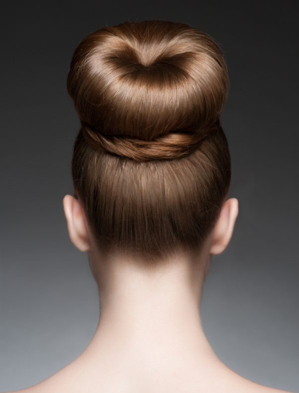 woman back thick elegant classic chignon hairstyle best formal hairstyles  viviscal blog Viviscal Healthy Hair Tips