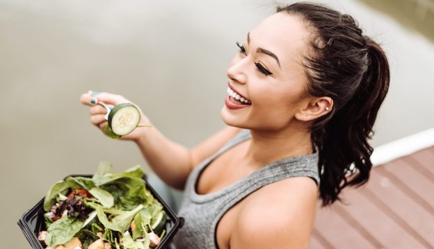 fitness woman eating salad best diet foods thicker healthier hair growth viviscal hair blog