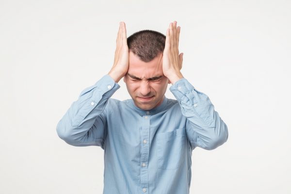 Stress frustration man holding head male hair loss causes prevention viviscal hair blog