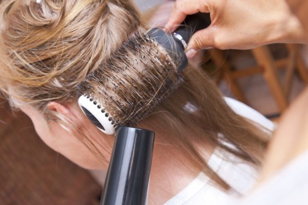 round brush blow drying close up blonde hair blowout best volume tips fine thin hair viviscal hair blog