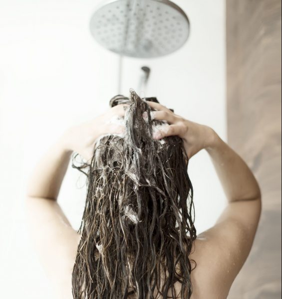 woman washing hair scrubbing scalp scalp circulation promote hair growth viviscal hair blog