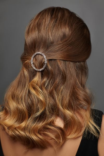 back woman curly red hair circle hair clip crystals the big hair clip trend for thin hair viviscal hair blog